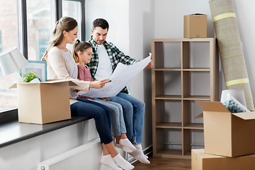 Image showing happy family with blueprint moving to new home