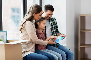 Image showing happy family with color palette moving to new home