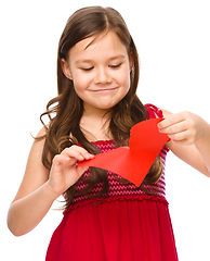 Image showing Portrait of a sad little girl in red