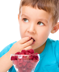 Image showing Little boy with raspberries