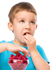 Image showing Little boy with raspberries