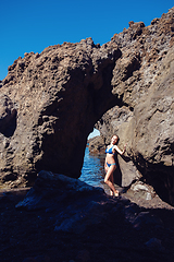 Image showing beautiful girl resting in natural ocean swimming pool