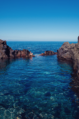 Image showing beautiful girl resting in natural ocean swimming pool