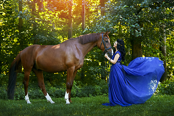 Image showing beautiful girl in dress with horse