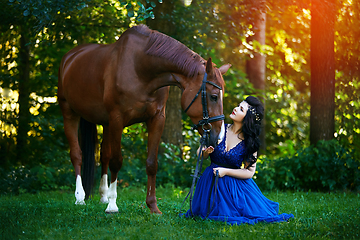 Image showing beautiful girl in dress with horse