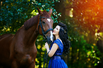 Image showing beautiful girl in dress with horse