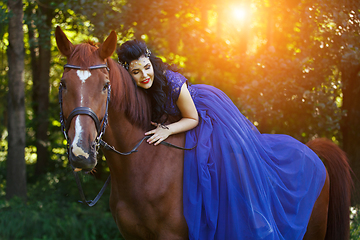 Image showing beautiful girl in dress with horse