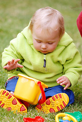 Image showing A girl with a little bucket