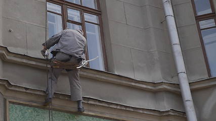 Image showing MOSCOW - AUGUST 26: Climber spends repair work on a multi-storey building height on August 26, 2017 in Moscow, Russia