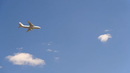 Image showing Military transport aircraft An-124 fly in blue sky