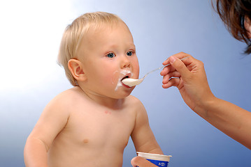 Image showing A child during the feeding