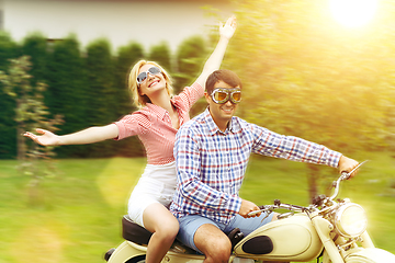 Image showing beautiful couple on retro motorbike