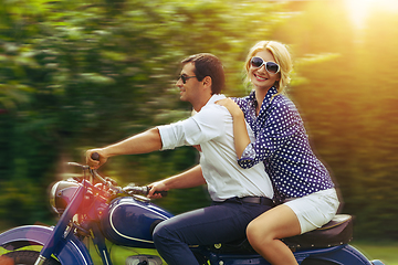 Image showing beautiful couple on retro motorbike