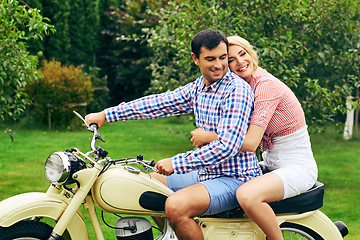 Image showing beautiful couple on retro motorbike