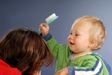 Image showing A girl with her mammy