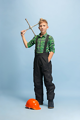 Image showing Boy dreaming about future profession of engineer