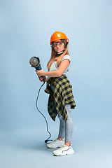 Image showing Girl dreaming about future profession of engineer