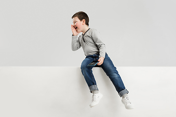 Image showing Caucasian boy isolated on white studio background. Copyspace. Childhood, education, emotions concept