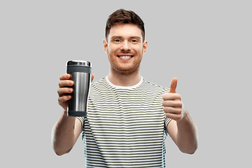 Image showing man with thermo cup or tumbler showing thumbs up