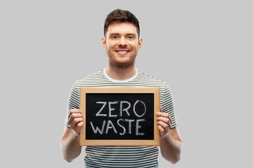 Image showing smiling man holding chalkboard with zero waste