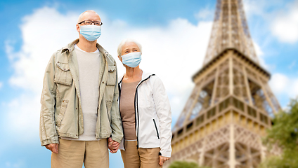 Image showing old couple in protective medical masks in france