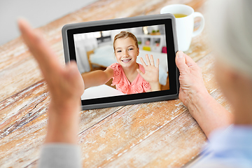 Image showing grandmother having video call with granddaughter