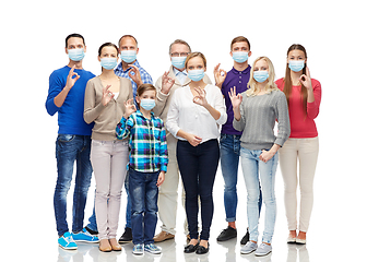 Image showing people in medical masks showing ok hand sign