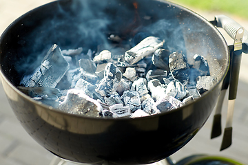 Image showing charcoal smoldering in brazier outdoors