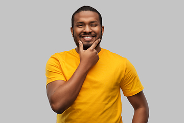 Image showing smiling african american man in yellow t-shirt