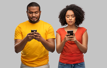 Image showing african american couple with smartphones