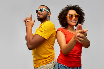 Image showing african couple in sunglasses makes finger gun