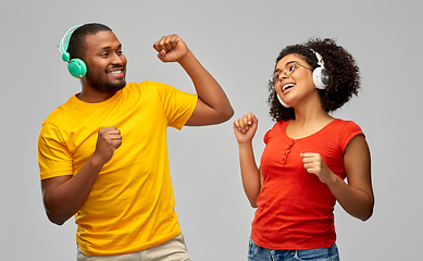 Image showing african american couple with headphones dancing