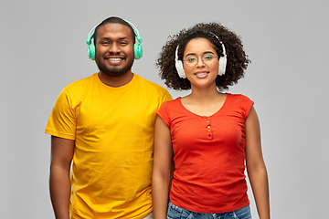 Image showing happy african american couple with headphones