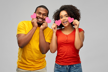 Image showing happy african american couple with hearts