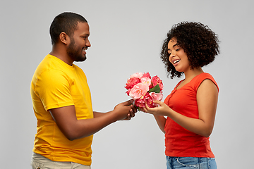 Image showing happy african american couple with flowers