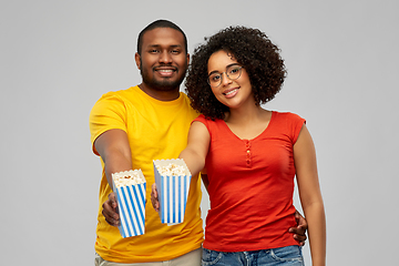 Image showing happy african american couple eating popcorn