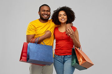 Image showing happy african american couple with shopping bags