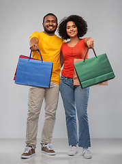 Image showing happy african american couple with shopping bags