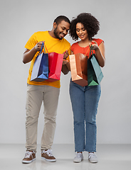 Image showing happy african american couple with shopping bags