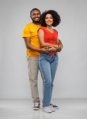 Image showing happy african american couple hugging