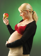 Image showing Pregnant woman with apple