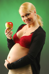 Image showing Pregnant woman with apple