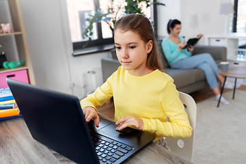 Image showing student girl with laptop learning online at home