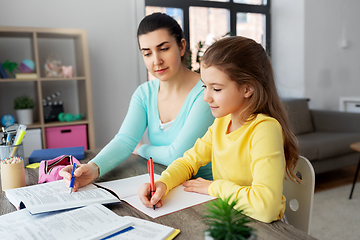 Image showing mother and daughter doing homework together