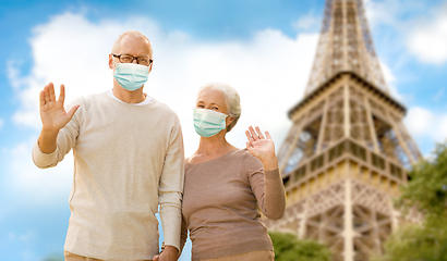 Image showing old couple in protective medical masks in france