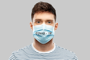 Image showing young man in face protective medical mask