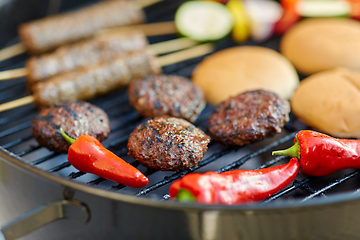 Image showing barbecue kebab meat and vegetables on grill