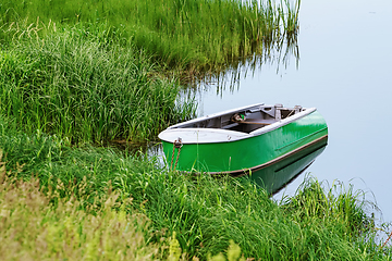 Image showing Metal rowboat on the lake 