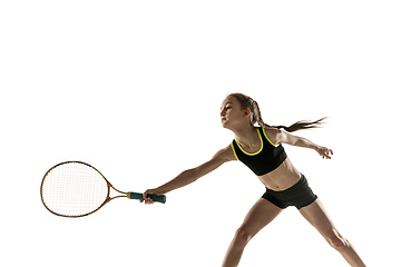 Image showing Little caucasian girl playing tennis isolated on white background