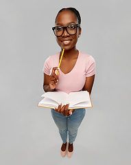 Image showing happy african american woman with notebook